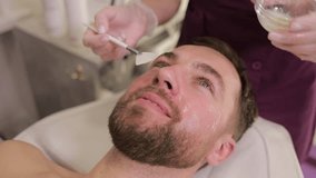 A man enjoys a rejuvenating facial treatment in a tranquil spa, promoting relaxation - Powered by Shutterstock - Get 15% off with code: PIKWIZARD15