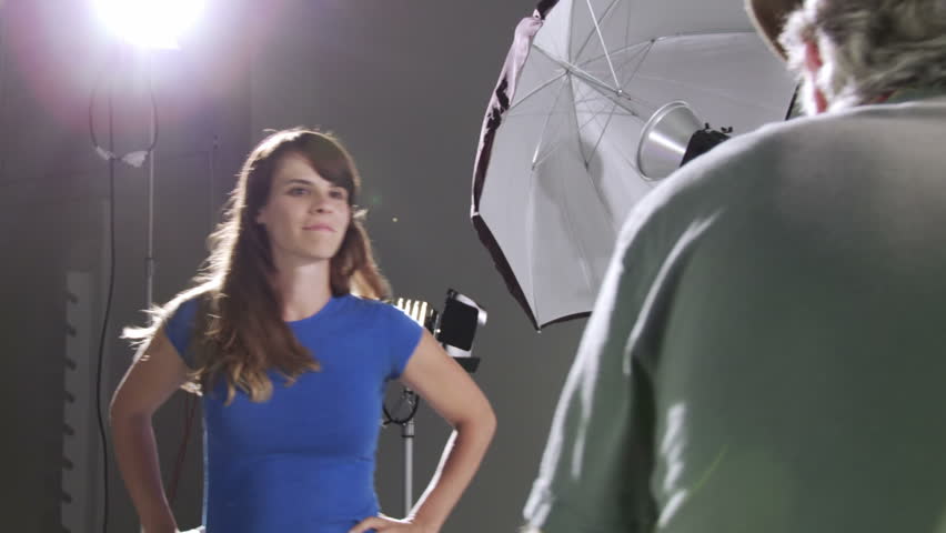 Photographer takes pictures of actress/model in studio. Deliberately edgy,