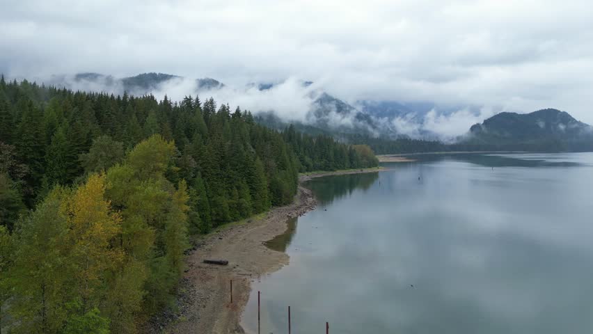 Misty Mountain Lake with Fog and Forest Reflections in British Columbia