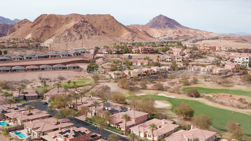 Aerial drone shot of Lake Las Vegas Nevada residential homes, trees, mountain 12 - Aerial Drone View