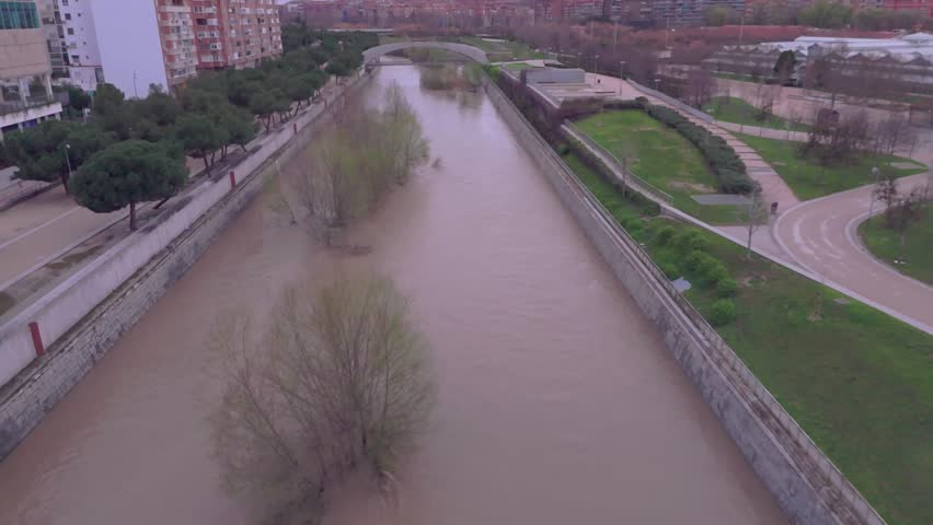 Manzanares river flooding in madrid during storm