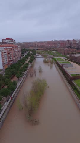 Manzanares river flooding in madrid during storm
