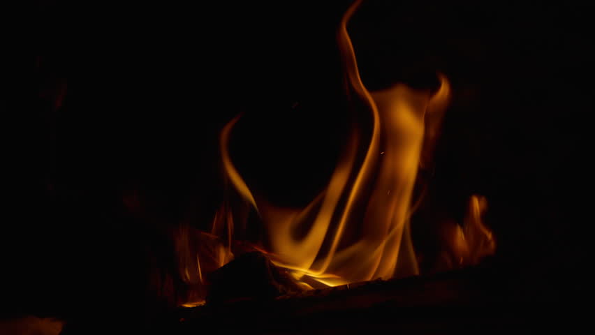 Close up of campfire flames burning in slow motion.