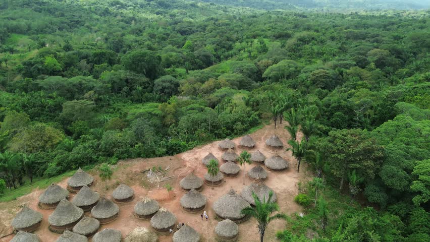 Breathtaking 4K aerial footage showcasing a remote mountain community nestled in the lush greenery of La Sierra Nevada de Santa Marta, Colombia.