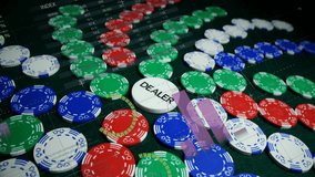 Poker chips and dealer button on table with colorful pie chart animation overlay. Gambling, casino, betting, strategy, gaming, finance - Powered by Shutterstock - Get 15% off with code: PIKWIZARD15