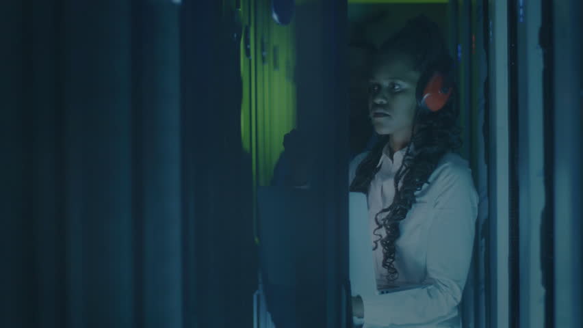 QR code scanning animation over person conducting security check in data center. Technology, cybersecurity, surveillance, digital, innovation, verification - Powered by Shutterstock - Get 15% off with code: PIKWIZARD15