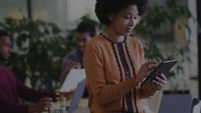 Using tablet with computer code overlay, woman in modern office animation. Technology, digital, innovation, coding, workspace, business - Powered by Shutterstock - Get 15% off with code: PIKWIZARD15