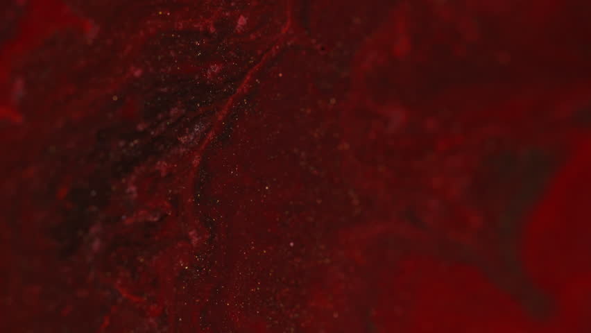 Sparkling marble. Red shimmer. Thick opaque liquid with gold glitter. Art suspension waves with shapeless smooth flow edge color exchange bright texture.