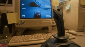 Close up shot of retro PC computer and racing videogame on screen in nostalgic setting lit by warm light, copy space - Powered by Shutterstock - Get 15% off with code: PIKWIZARD15