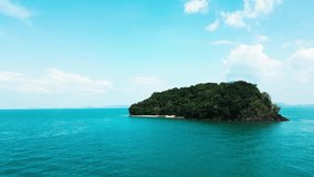 Drone shot of a sailboat in a secluded tropical bay with calm waters, breathtaking island getaway featuring boats resting in a tranquil lagoon with golden sand and palm trees nearby. - Powered by Shutterstock - Get 15% off with code: PIKWIZARD15
