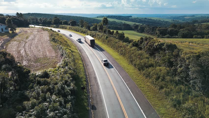 Aerial view of the highway BR277 with cars and trucks moving on it. State of Parana, Brazil