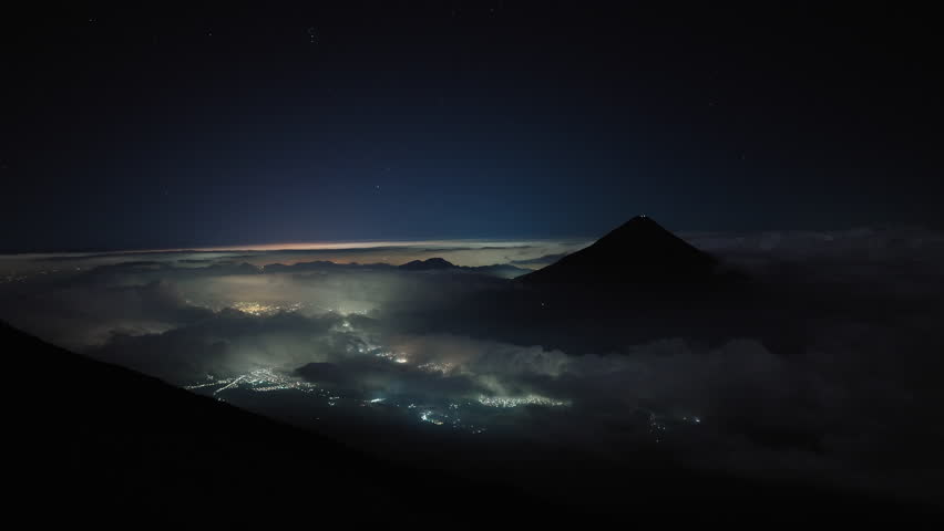 Antigua as seen from Acatenango volcano during night, Guatemala. Static shot