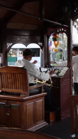Organist playing music by the river