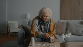 Elderly woman feeling weakness and fever symptoms and taking pills - Powered by Shutterstock - Get 15% off with code: PIKWIZARD15