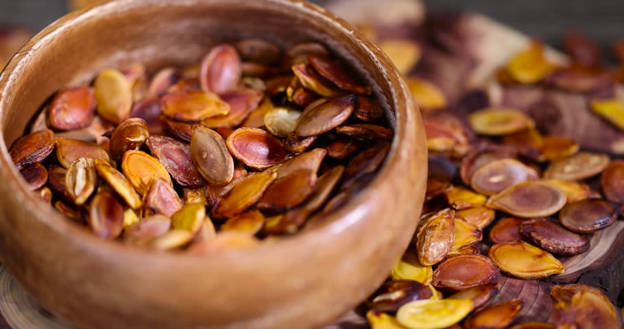 golden pumpkin seeds fried scattered pumpkin seeds fried on fire and partially burned and inedible