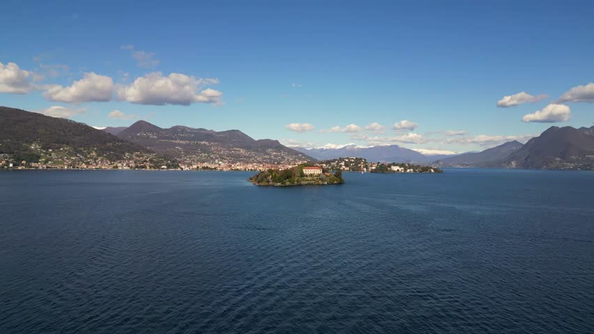 slow mo drone above scenic video of Barromean Isola Bella islands on north Italian Maggiore Lake in sunny days