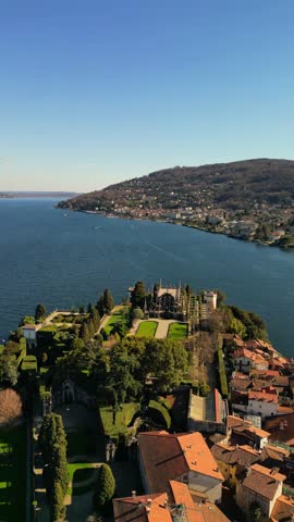 slow mo drone above scenic video of Barromean Isola Bella islands on north Italian Maggiore Lake in sunny days 