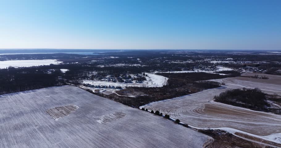 Drone Flies High Above Rural Farmland on Freezing Cold Winter Day in USA