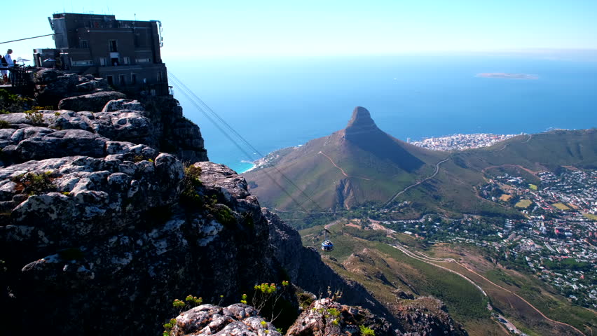Table Mountain cable car on aerial cableway arrives at upper station