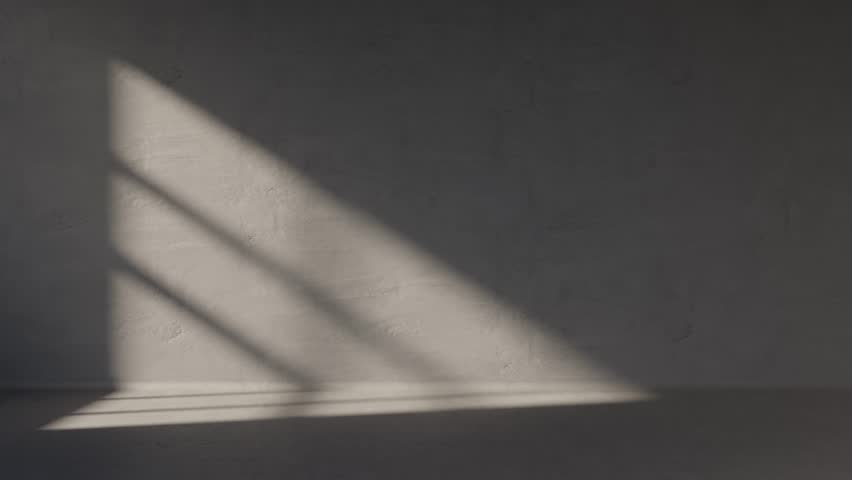 Empty concrete room with window light motion from sunrise. building gray wall in apartment with sunlight shadow. Industrial office space showroom. Abstract architecture background.