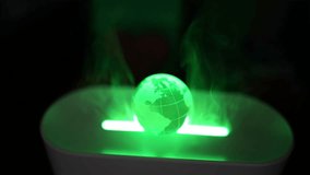 Glowing Green Holographic Globe Projection, A glowing green holographic globe with a grid pattern appears above a light source - Powered by Shutterstock - Get 15% off with code: PIKWIZARD15