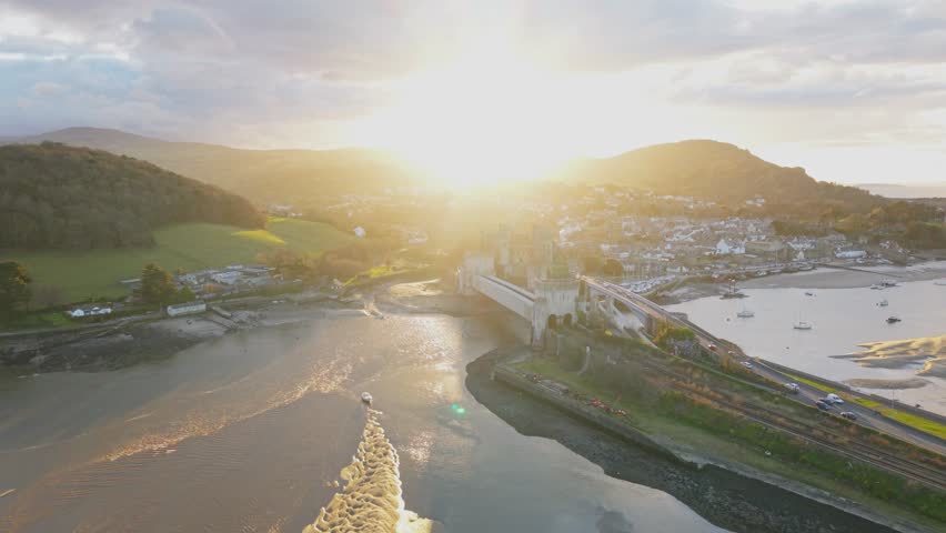 Epic Sunset and Golden Hour of Conwy Castle, River Conwy Estuary and Bridge, North Wales