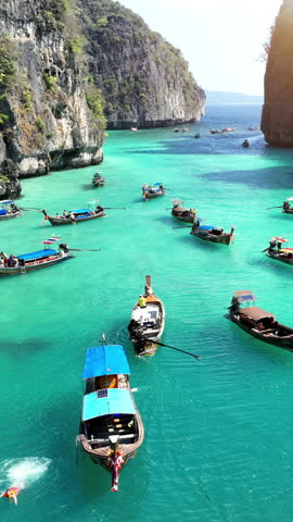 Tourist relaxing on Longtail boats at Koh Phi Phi Don island in Ao Nang, Krabi, Thailand.