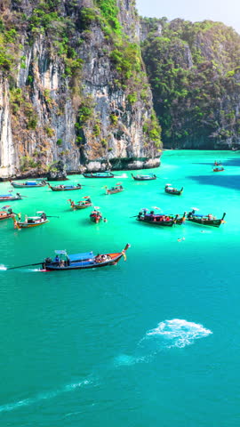 Tourist relaxing on Longtail boats at Koh Phi Phi Don island in Ao Nang, Krabi, Thailand.