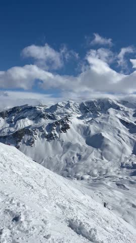 Snowcapped mountains in French alps and amazing slopes of Courchevel ski resort.