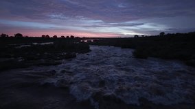 Slo mo Sabi River rapids in pre dawn sunrise landscape of South Africa - Powered by Shutterstock - Get 15% off with code: PIKWIZARD15