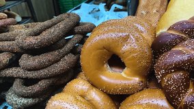 Sesame bagel, pretzel. Fresh baked goods on the farmer's market stand. Turkish Simit and Sticky Buns - Powered by Shutterstock - Get 15% off with code: PIKWIZARD15