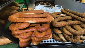 Sesame bagel, pretzel. Fresh baked goods on the farmer's market stand. Turkish Simit and Sticky Buns - Powered by Shutterstock - Get 15% off with code: PIKWIZARD15