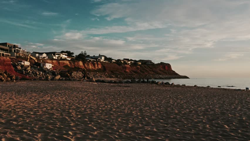 Seaside Cliff Houses at Australian Sandy Beach at Sunset Moody Blue Sky Clouds