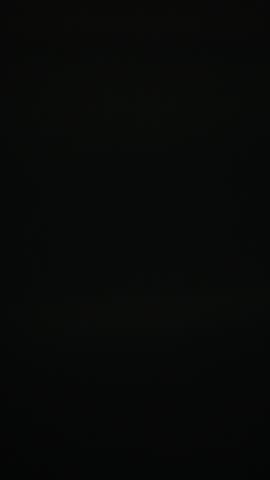 Vibrant urban night lights blur into dynamic motion streaks with a rapid swish pan