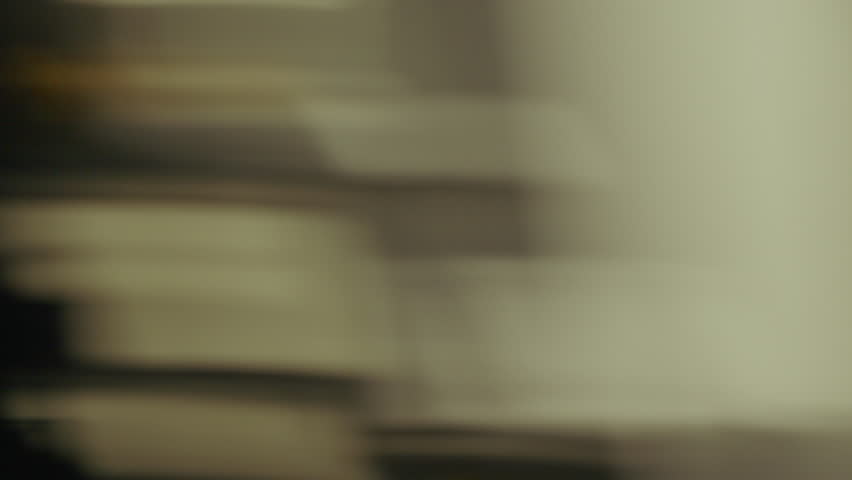 A dynamic whip pan capturing the blurred motion of vibrant neon signs and glowing streetlights