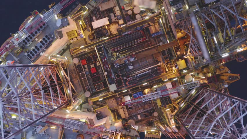 Aerial view of an offshore jack up drilling rig during sunset - oil and gas upstream industry
