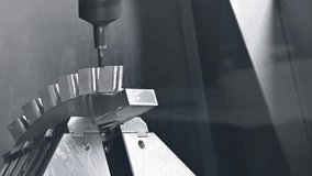 Pan scene the 5-axis CNC milling machine cutting the water turbine blade part with solid ball end mill tool. The hi-technology automotive part manufacturing process by multi-axis CNC milling machine. - Powered by Shutterstock - Get 15% off with code: PIKWIZARD15