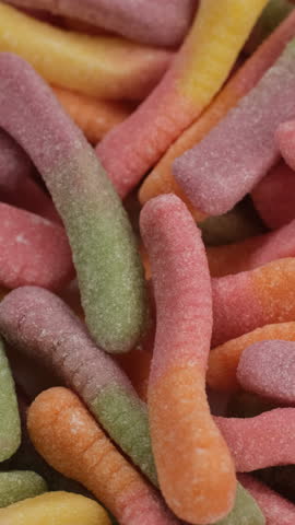 Zoom frame Colorful gummy candy worms, close up