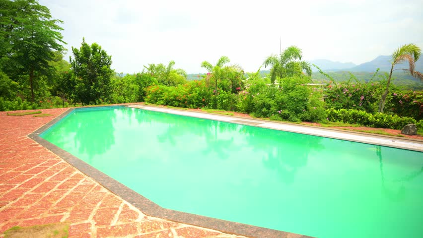 Serene Poolside Escape with Greenery and Blossoms, Tranquil Garden Pool Surrounded by Lush Landscaping, Calm retreat hold clean basin amid vibrant foliage, Dazzling flower bloom beside peaceful lagoon