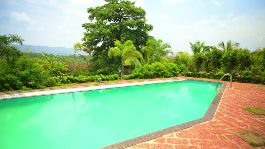 Tranquil Garden Pool Surrounded by Lush Landscaping, Serene Poolside Escape with Greenery and Blossoms, Calm retreat hold clean basin amid vibrant foliage, Dazzling flower bloom beside peaceful lagoon