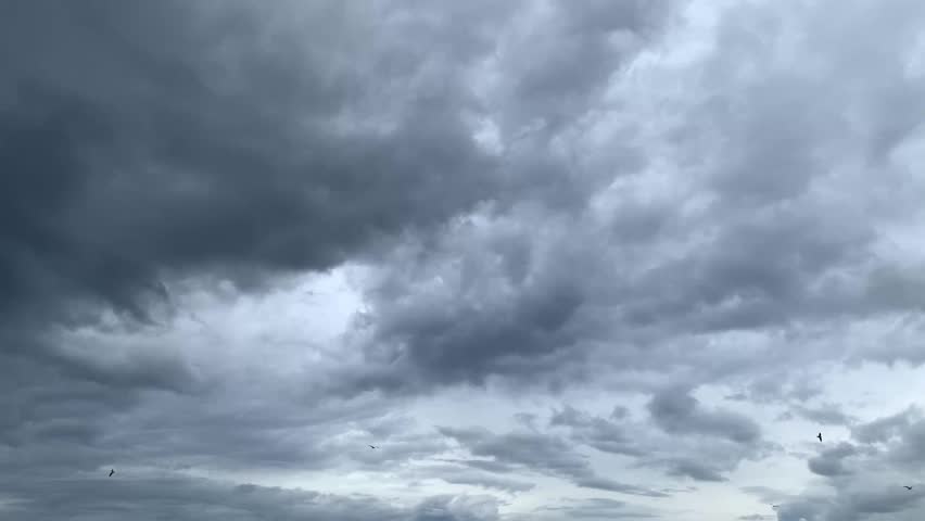Dramatic cloudy sky over Marbella, Andalusia, Spain. Layers of textured gray clouds create a moody and atmospheric scene, capturing the beauty of stormy weather