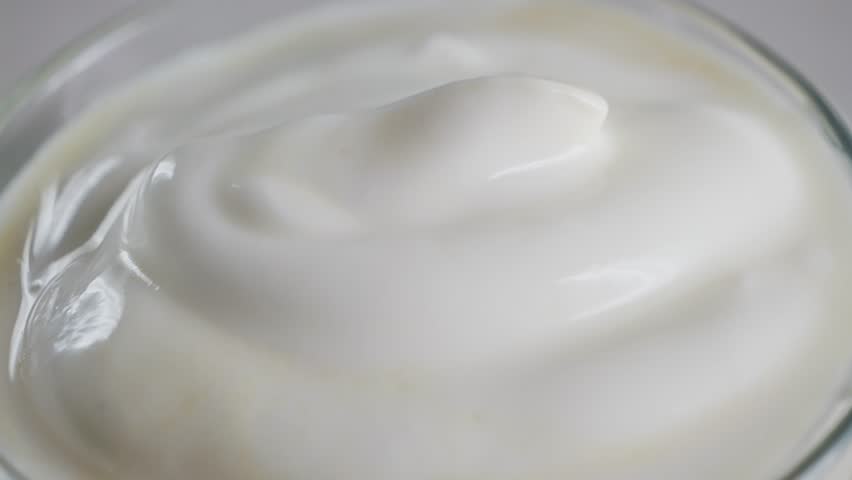 Mayonnaise sauce in bowl close up footage. Sour cream, fresh Greek yogurt. High quality 4k footage