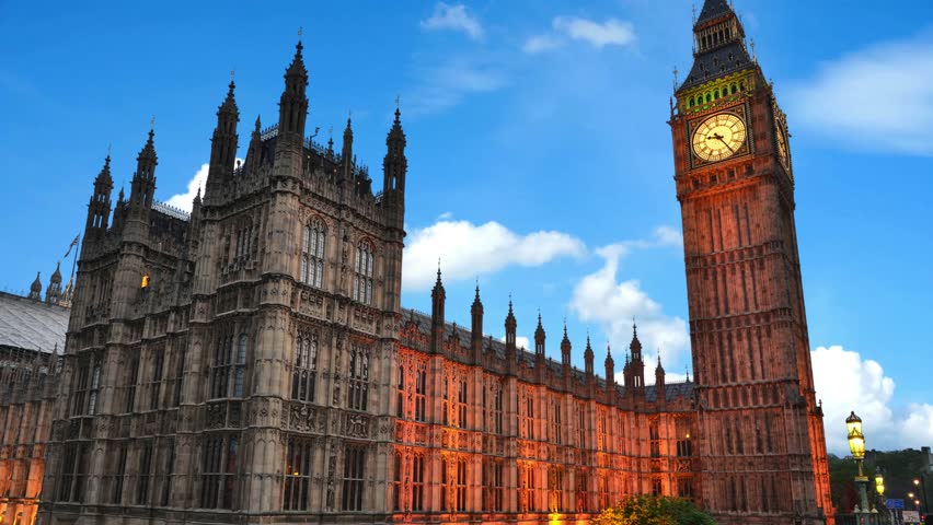 Double-decker buses and black cab on Westminster bridge with Big Ben and Houses of Parliament at background, London, UK Big Ben with Houses of Parliament and Westminster bridge, London, UK