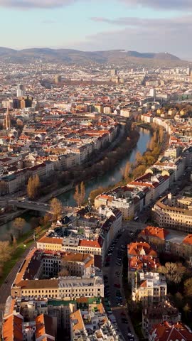 Vienna, Austria Aerial View: Sunset Over City Center and Canal. Top cinematic aerial view. 4K drone footage