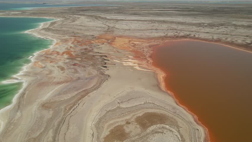 Aerial video over the beautiful desert landscapes of the Dead Sea Israel