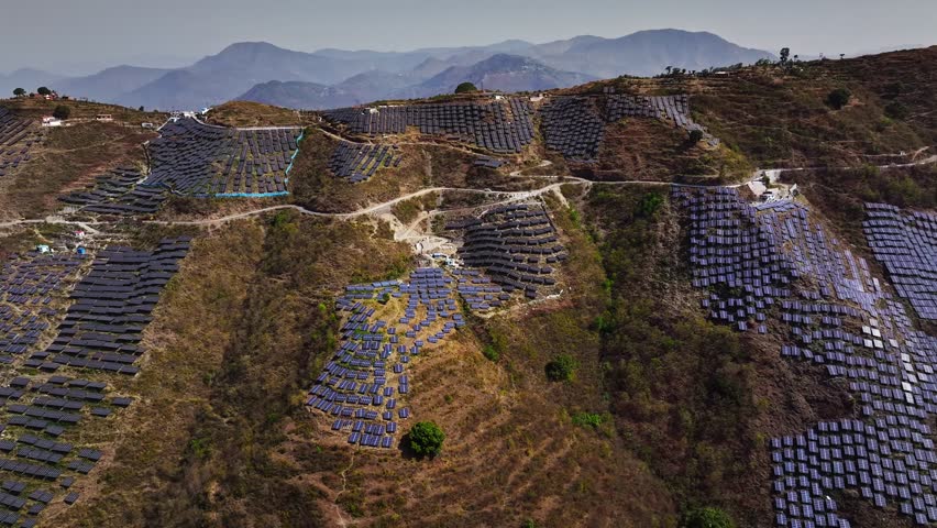 A solar power station situated atop a Himalayan mountain in Uttarakhand, India, harnesses renewable energy at high altitudes. This advanced solar installation contributes to sustainable development.
