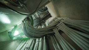 Organized bundle of insulated electrical and network cables in utility corridor - Powered by Shutterstock - Get 15% off with code: PIKWIZARD15