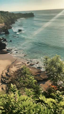 eautiful afternoon view before sunset from the top of this cliff. Seeing the horizon and waves from the beautiful ocean.