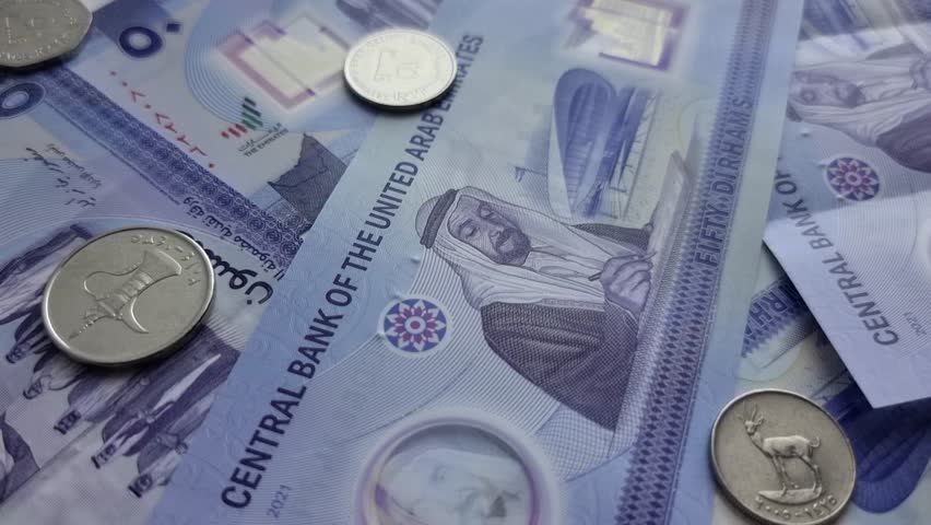 4K Close Up of new UAE 50 dirhams currency notes, paper money, against white background, released on Dec, 2021 to mark Golden jubilee. Finance and Economy concepts.