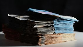 Dramatic shadowed shot of stacked euro banknotes, focusing on blue 20 euro notes - Powered by Shutterstock - Get 15% off with code: PIKWIZARD15